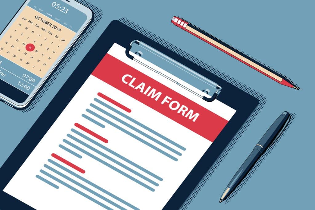 A graphic of injury claim form sitting on a desk with pens and a smartphone sitting around it.