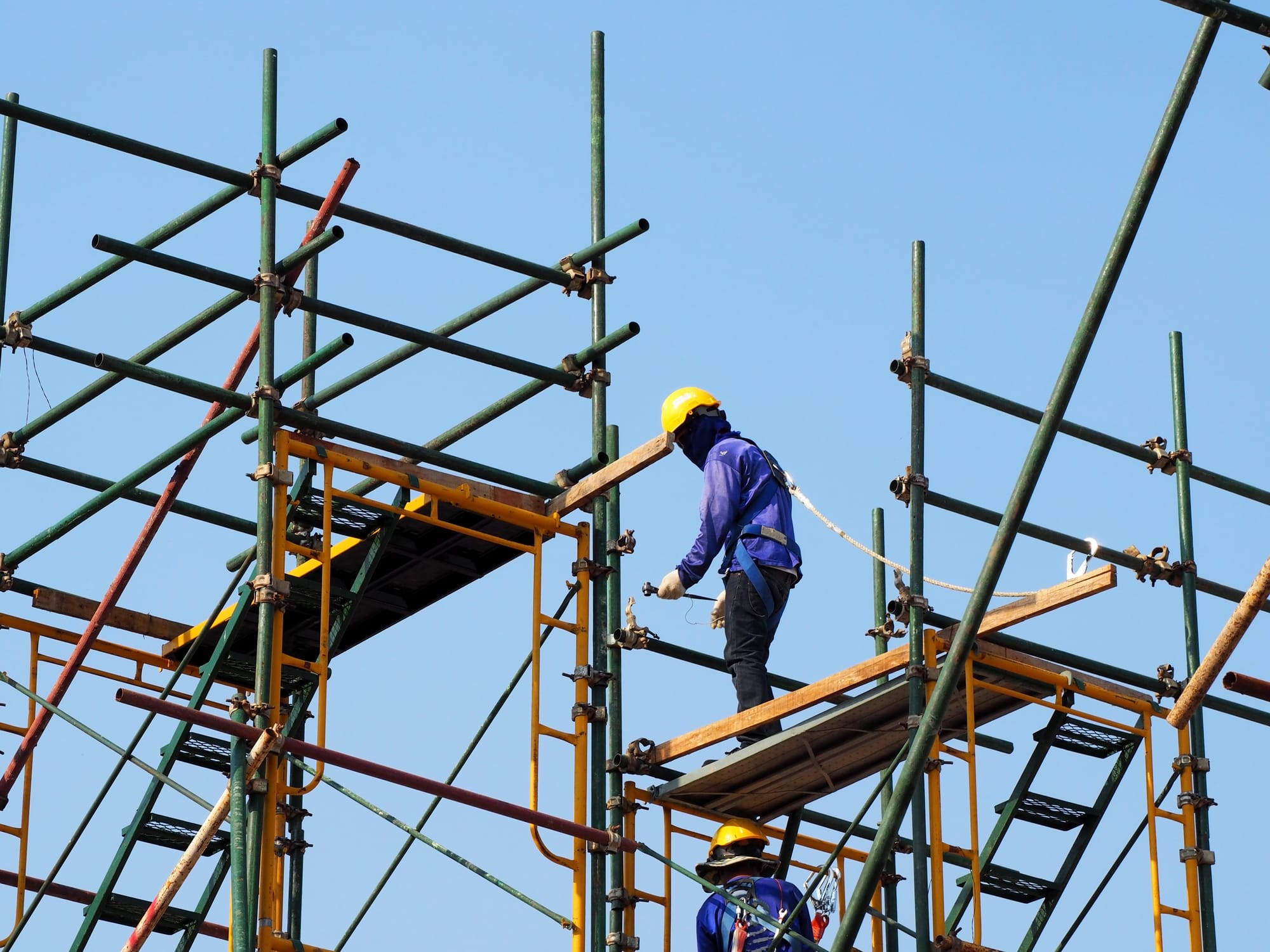 A man working on scaffolding.