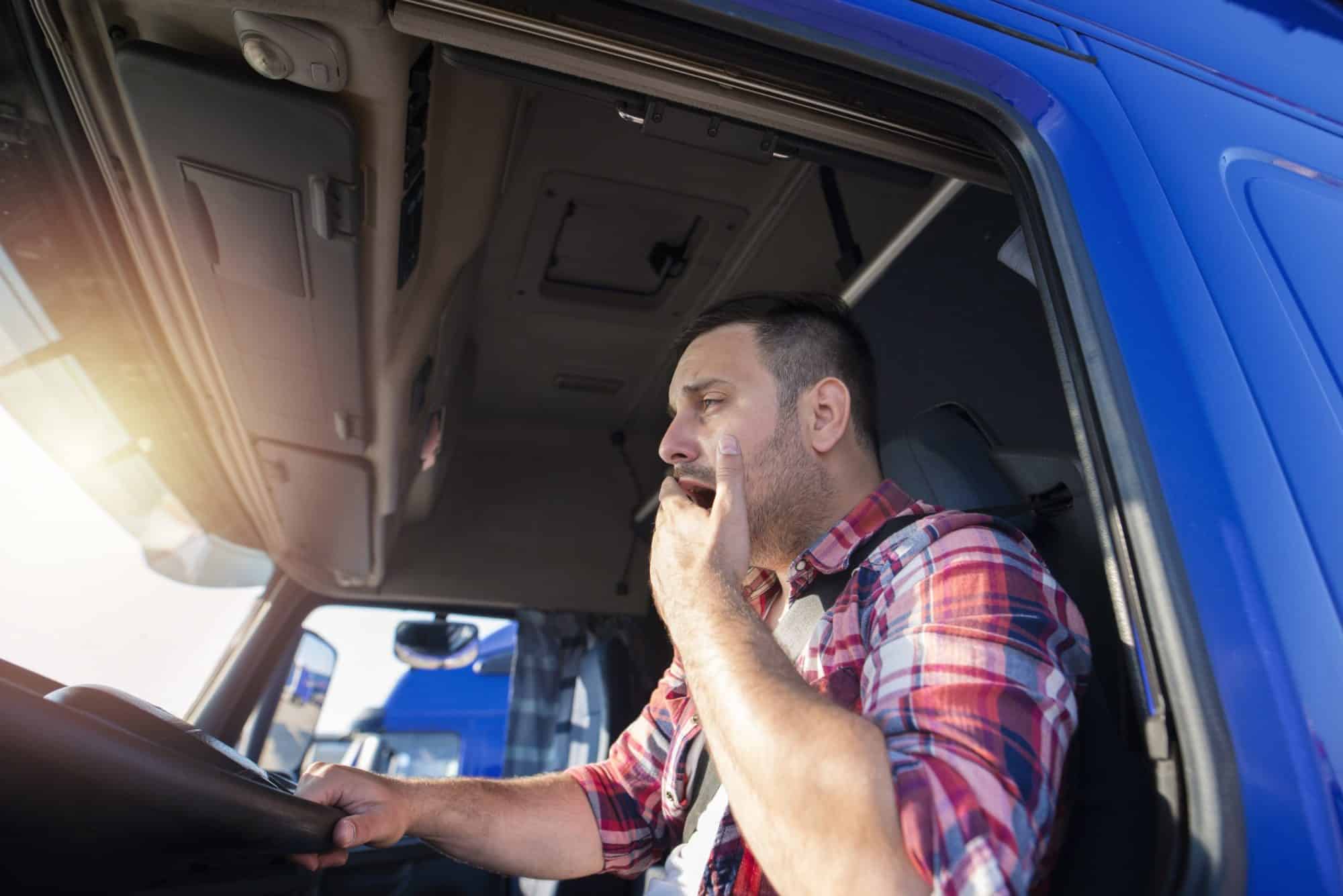 truck driver showing signs of drowsy driving