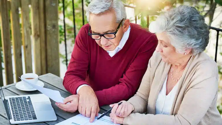 Elderly Couple Reviewing Their Finances Together Stock Photo
