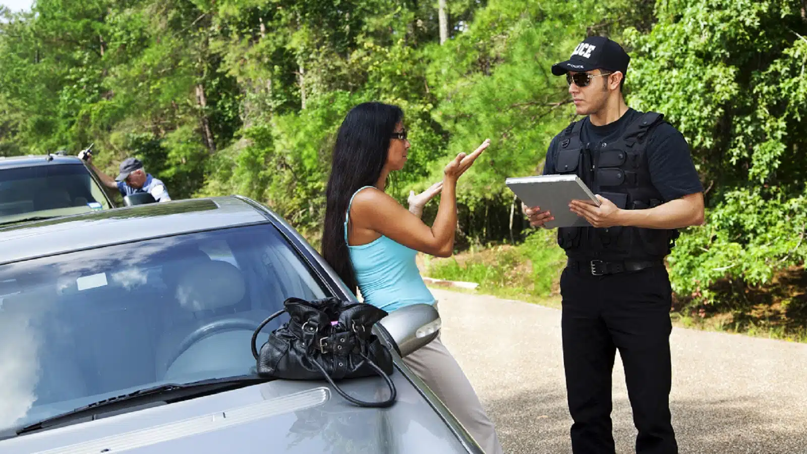 Police Officer Writing A Police Report Stock Photo