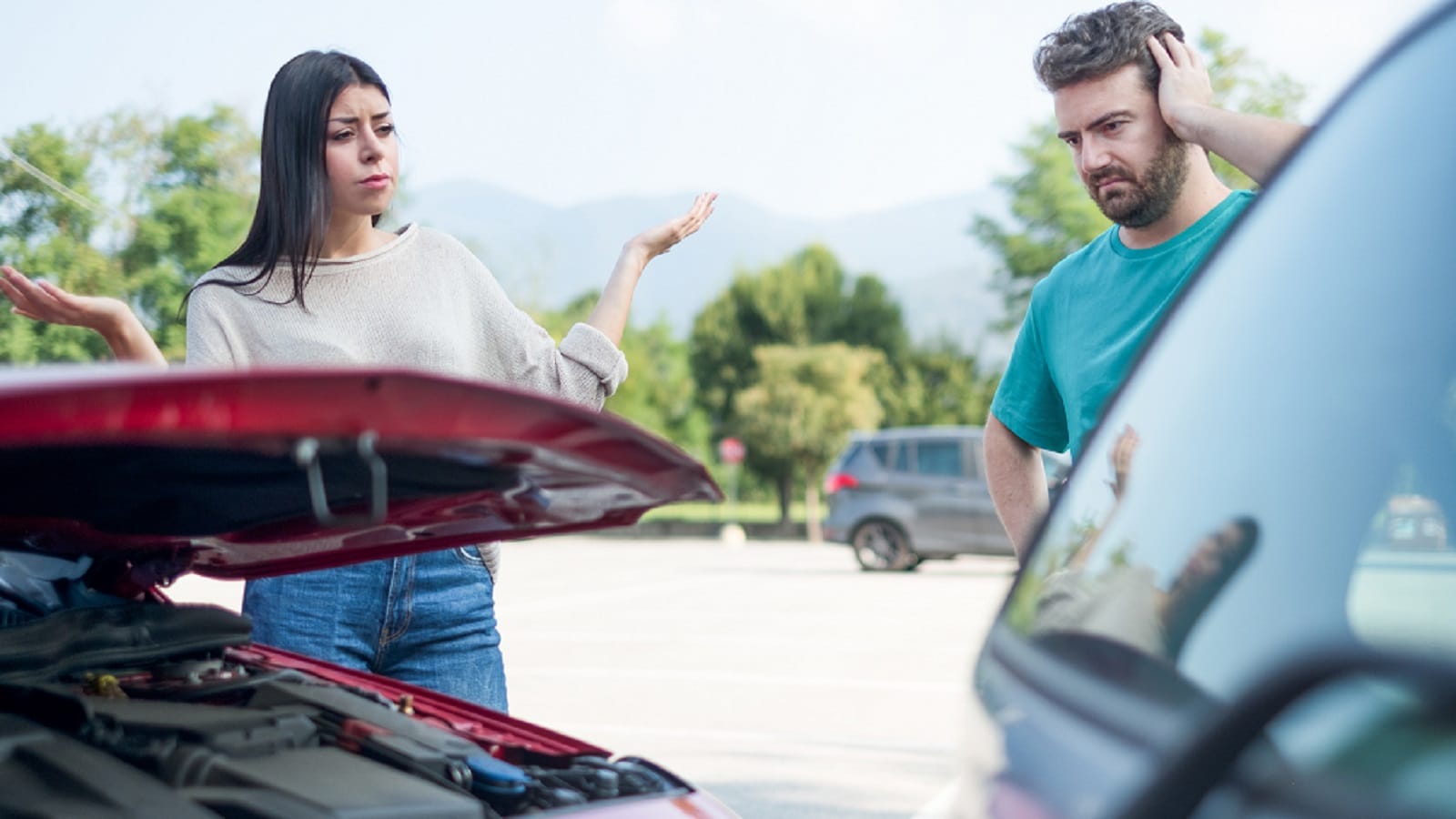 Drivers Arguing After A Car Accident Stock Photo