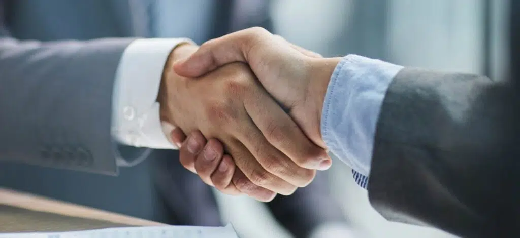 two professional people shaking hands