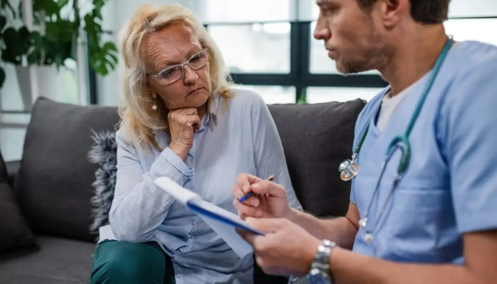 A woman talking with a medical professional