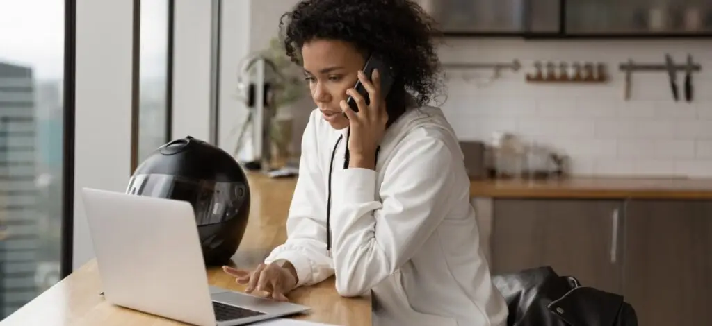 A woman on the phone discussing a motorcycle accident
