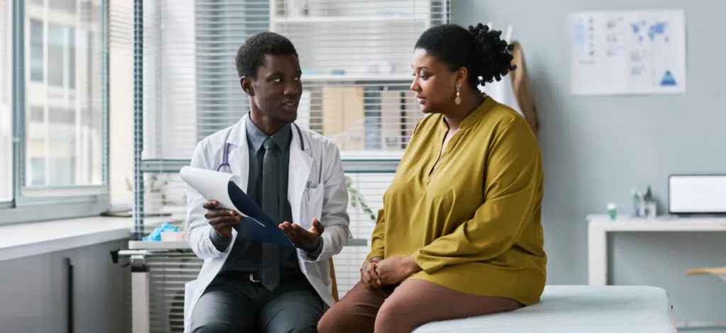 A woman meeting with a medical professional