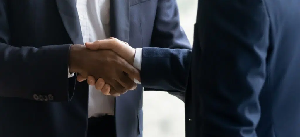 A client shakes hands with a personal injury attorney