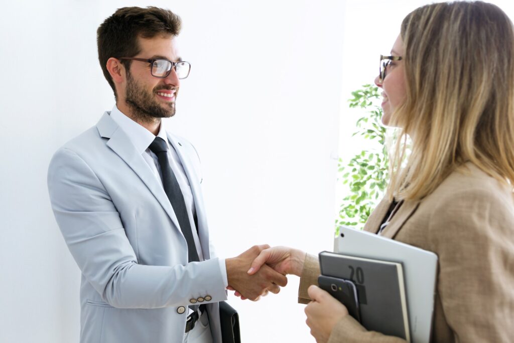 Attorney and client shaking hands after agreeing to represent them in a personal injury claim