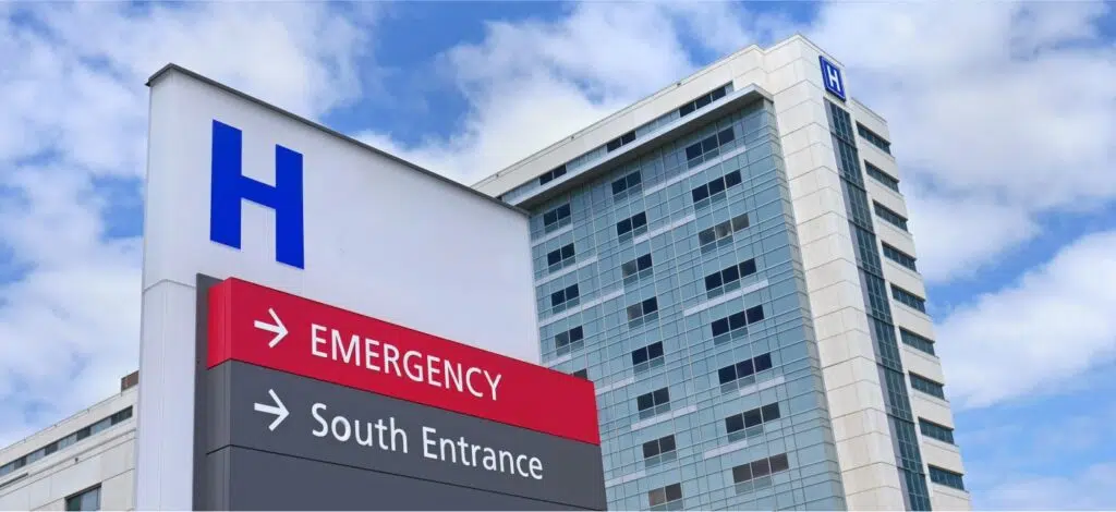 Outside view of a hospital and the emergency room sign