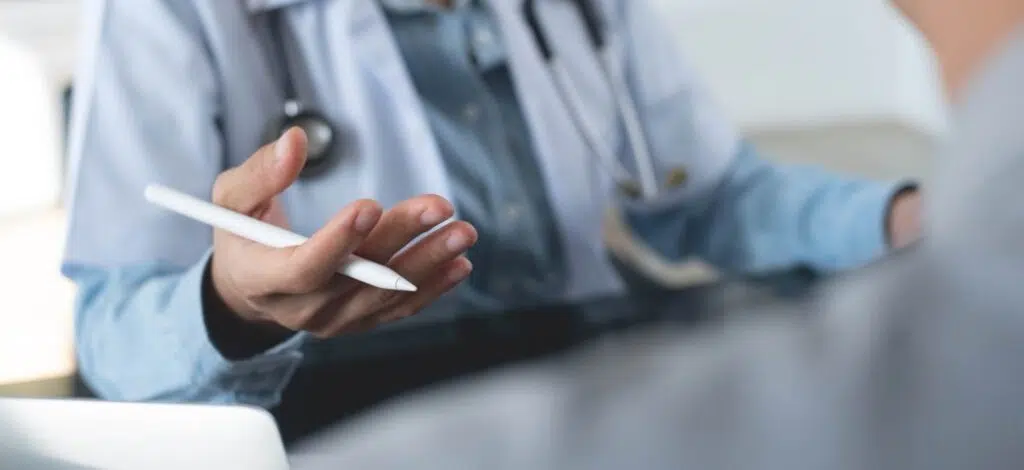 closeup of a medical professional explaining something to a patient