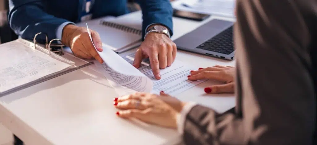 two people reviewing paperwork for a disability claim