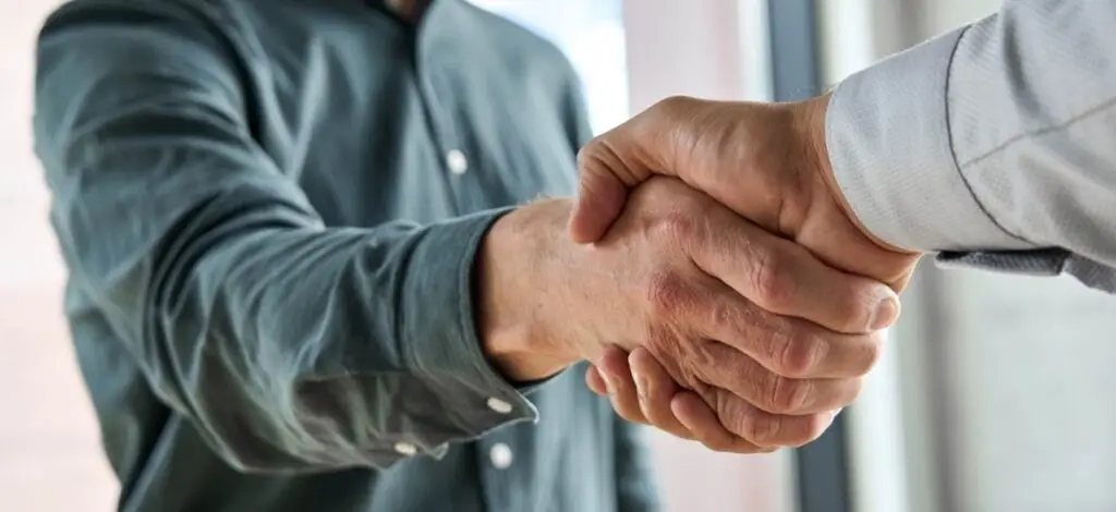 two people shaking hands