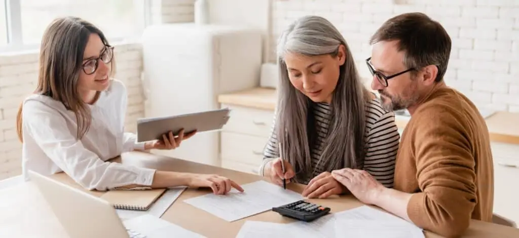A couple consulting with a disability attorney
